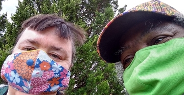 Helena Carnes and Malvin Jeffries in colorful COVID masks